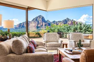 a living room with a view of the mountains at Sedona Luxury with 75’ Lap Pool, Hot Tub & Breathtaking Vortex Views in Sedona