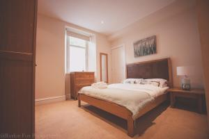 Ένα ή περισσότερα κρεβάτια σε δωμάτιο στο Apartment B