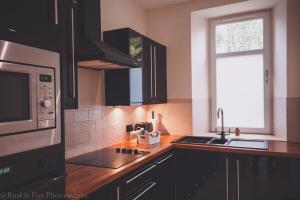 Η κουζίνα ή μικρή κουζίνα στο Apartment B