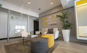 a living room with a couch and a table at Barranco Modern Apartments with Rooftop Pool by Geko in Lima