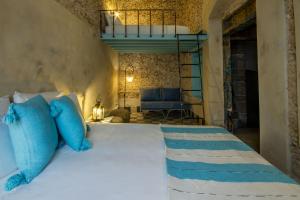 Ένα ή περισσότερα κρεβάτια σε δωμάτιο στο Dar Ferran