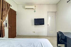 Μια τηλεόραση ή/και κέντρο ψυχαγωγίας στο K Home Syariah Mitra RedDoorz