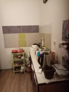 a kitchen with a counter and a counter top at One in La Plaine des Palmistes +8 photos