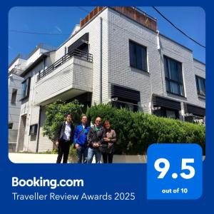 a group of people standing in front of a building at Ys Bed & Kitchen Tokyo #HY1 in Tokyo