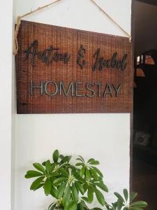 a sign that reads autism and needed homesstay next to a plant at Anton & Isabel HomeStay Bangued in Bangued +66 photos