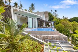 an exterior view of a house with a swimming pool at Luxury Private Villa Resort -KW in Nathon Bay