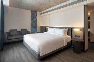 Postel nebo postele na pokoji v ubytování Radisson Hotel Don Mueang Bangkok