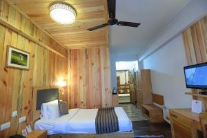TV a/nebo společenská místnost v ubytování Hotel Phuntsho pelri