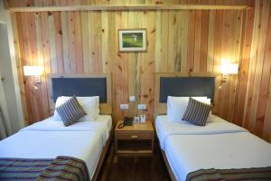 Postel nebo postele na pokoji v ubytování Hotel Phuntsho pelri