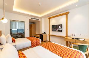 TV a/nebo společenská místnost v ubytování Hotel Anuttara