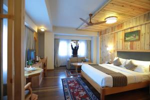 Postel nebo postele na pokoji v ubytování Hotel Phuntsho pelri