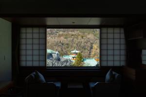 a window in a room with a view at The Fujiya Hotel in Hakone +175 photos