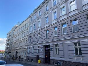 a large building on the side of a street at Apartament Kapitańska in Szczecin
