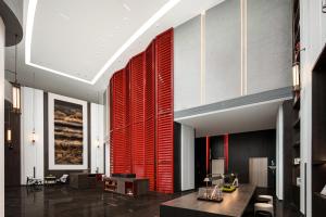 a lobby with red blinds on the wall at Gwen Jane Hotel Free shuttle buses at the exhibition hall during the Canton Fair in Guangzhou