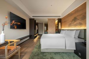 Voodi või voodid majutusasutuse JINGCADIA Hotel Nanjing Confucius Temple toas