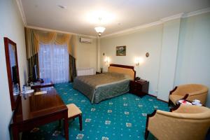 Ένα ή περισσότερα κρεβάτια σε δωμάτιο στο Imperator Hotel