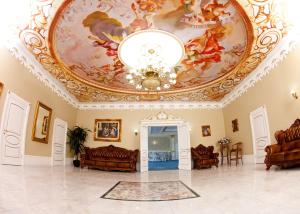 a room with a ceiling with a painting on it at Imperator Hotel in Tula