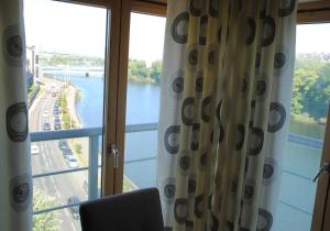 a room with a window with a view of a river at Executive 3 Bed Apartment Aberdeen in Aberdeen +49 photos