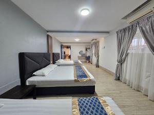Postel nebo postele na pokoji v ubytování Melody Whole Or Suite Room