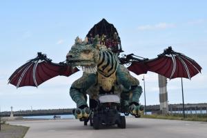 a statue of a dragon riding a motorcycle at 2 chambres pour 6 pers proche plage et cap gris nez in Calais +2 photos