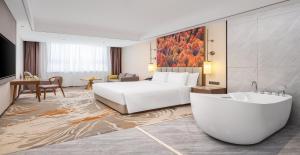 Posezení v ubytování Wanda Jin Hotel Karamay Dushanzi Huiyang