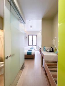 Postel nebo postele na pokoji v ubytování ABC Hotel CEBU