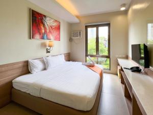 Postel nebo postele na pokoji v ubytování ABC Hotel CEBU