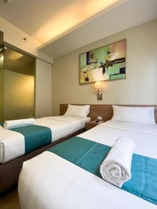 Postel nebo postele na pokoji v ubytování ABC Hotel CEBU + 22 fotografií