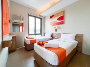 Postel nebo postele na pokoji v ubytování ABC Hotel CEBU