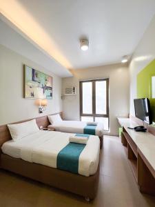 TV a/nebo společenská místnost v ubytování ABC Hotel CEBU