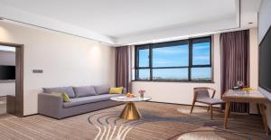 Posezení v ubytování Wanda Jin Hotel Karamay Dushanzi Huiyang