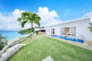 a house with a view of the ocean at Crystal Villa Miyakojima Sunayama Beach in Miyako Island