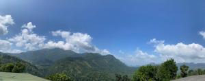 a view of mountains with a blue sky and clouds at Relax mountain guest house in Badulla