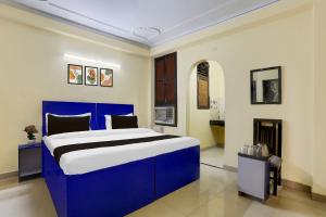 Postel nebo postele na pokoji v ubytování Super Hotel O Sheetla Colony
