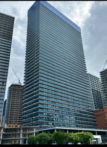 a tall building with many windows in a city at Batum World 2014 in Batumi