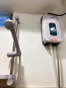 a toaster hanging on a wall next to a microphone at BGC Suites EDSA Makati in Manila