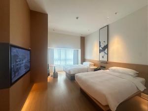 Voodi või voodid majutusasutuse Fairfield by Marriott Quanzhou Fengze toas
