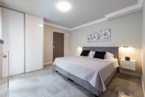 Postel nebo postele na pokoji v ubytování Apartments MaKris No1