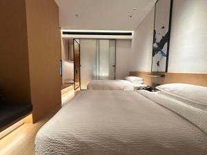 Voodi või voodid majutusasutuse Fairfield by Marriott Quanzhou Fengze toas