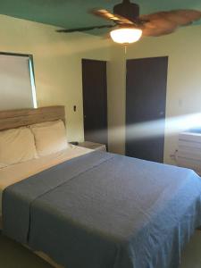 Кровать или кровати в номере Mamacitas Guest House