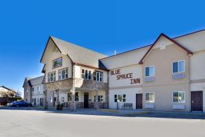 a large building with a street in front of it at Blue Spruce Inn-Meeker, Colorado in Meeker