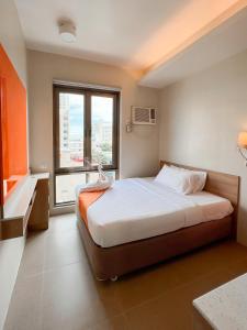 Postel nebo postele na pokoji v ubytování ABC Hotel CEBU