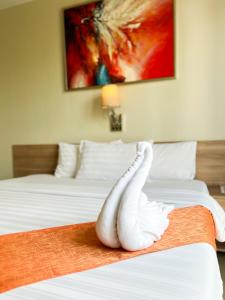 Postel nebo postele na pokoji v ubytování ABC Hotel CEBU