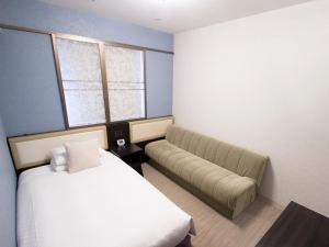 Postel nebo postele na pokoji v ubytování Hearton Hotel Kita Umeda