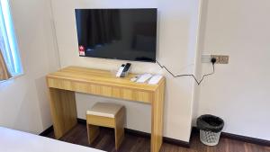 TV a/nebo společenská místnost v ubytování NEW Xing Yue Hotel 星悦自助酒店