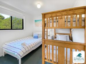 a bedroom with a bunk bed and a ladder at Town & Tide, Cowes Central in Cowes