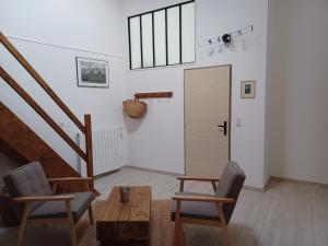 Posezení v ubytování Mas de la Borie -Chambre d'hôtes