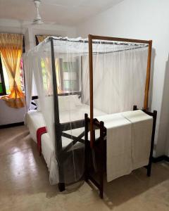 Postel nebo postele na pokoji v ubytování Grand Villa Hikkaduwa