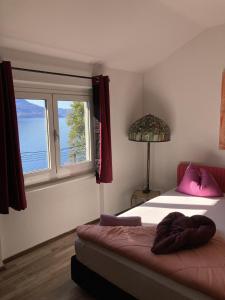 Rúm í herbergi á BnB122 bed&breakfast