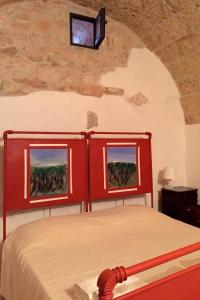 Postel nebo postele na pokoji v ubytování Feudo Pajara Bracchio 2 by Salento Prime